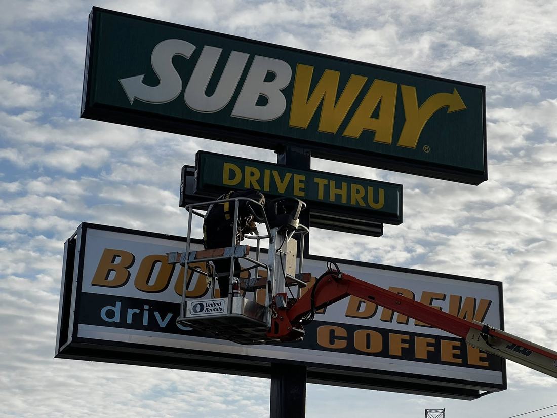 Building signs, installed with our own lifts